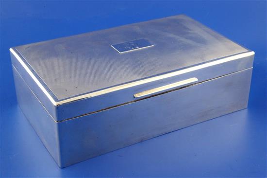 A 1940s engine turned silver mounted rectangular cigar/cigarette box by Mappin & Webb, 10in.